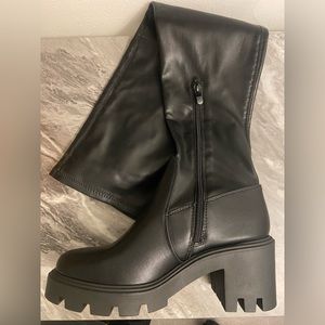 Cleated Knee High Zip Heeled boots.